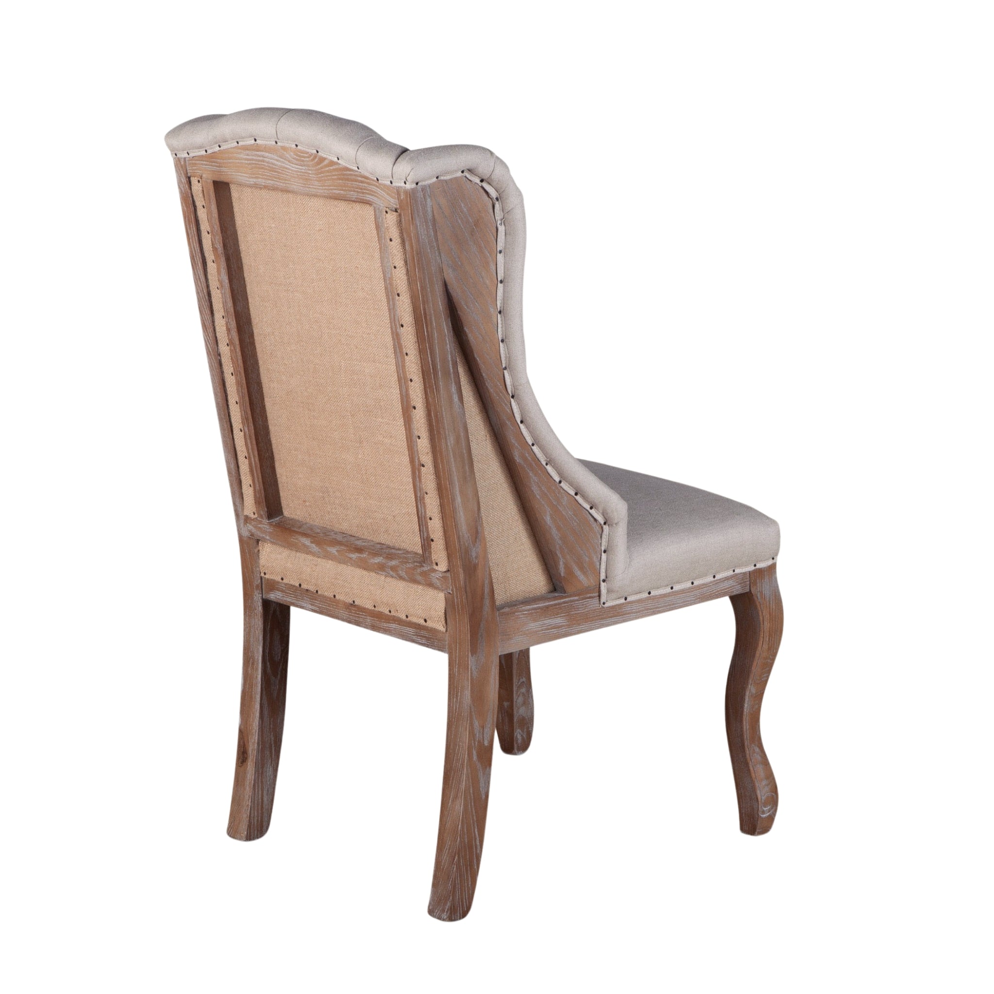Deconstructed-style dining chair with tufted back, linen upholstery, and whitewashed solid wood frame