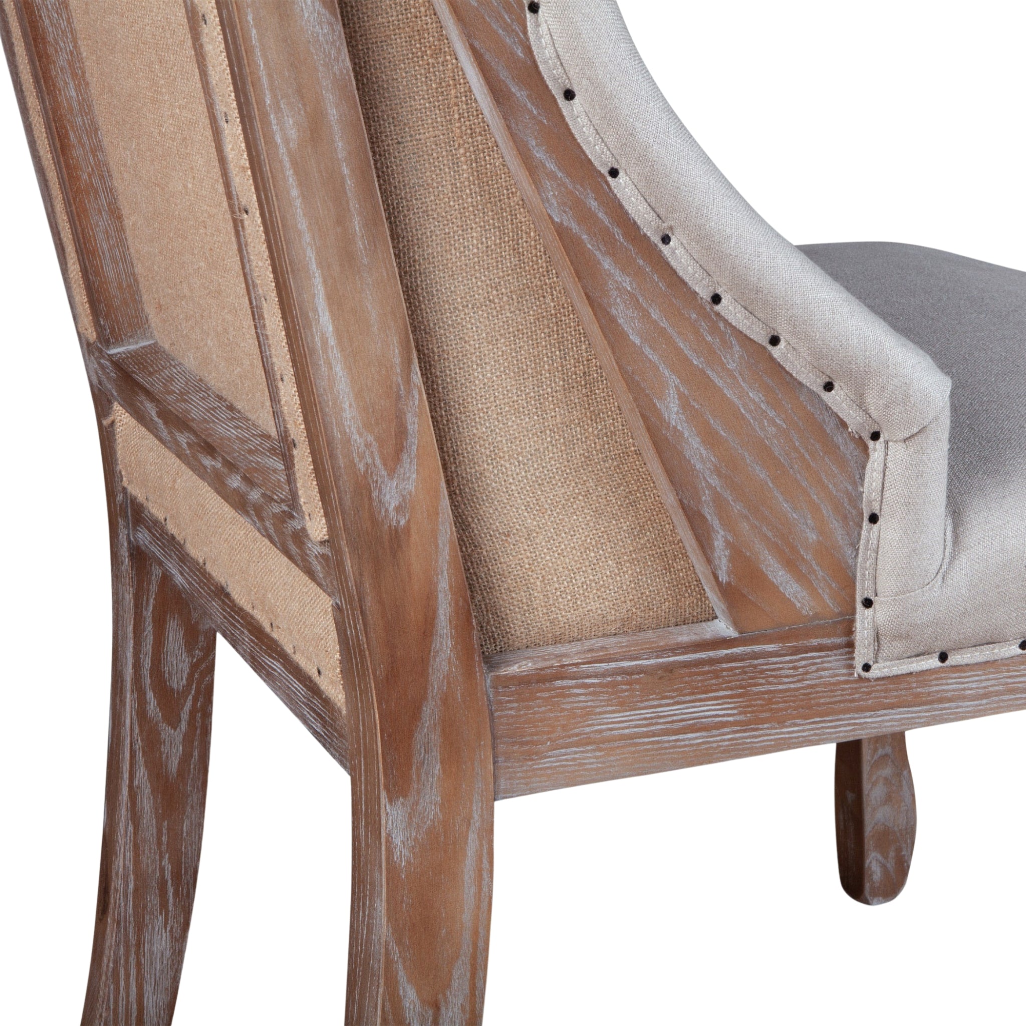 Tufted dining chair featuring high backrest, linen-blend fabric, and carved whitewashed legs