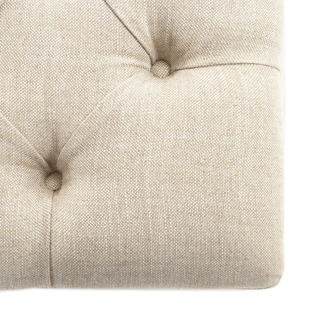 Square tufted ottoman in limed grey oak finish adds rustic charm.