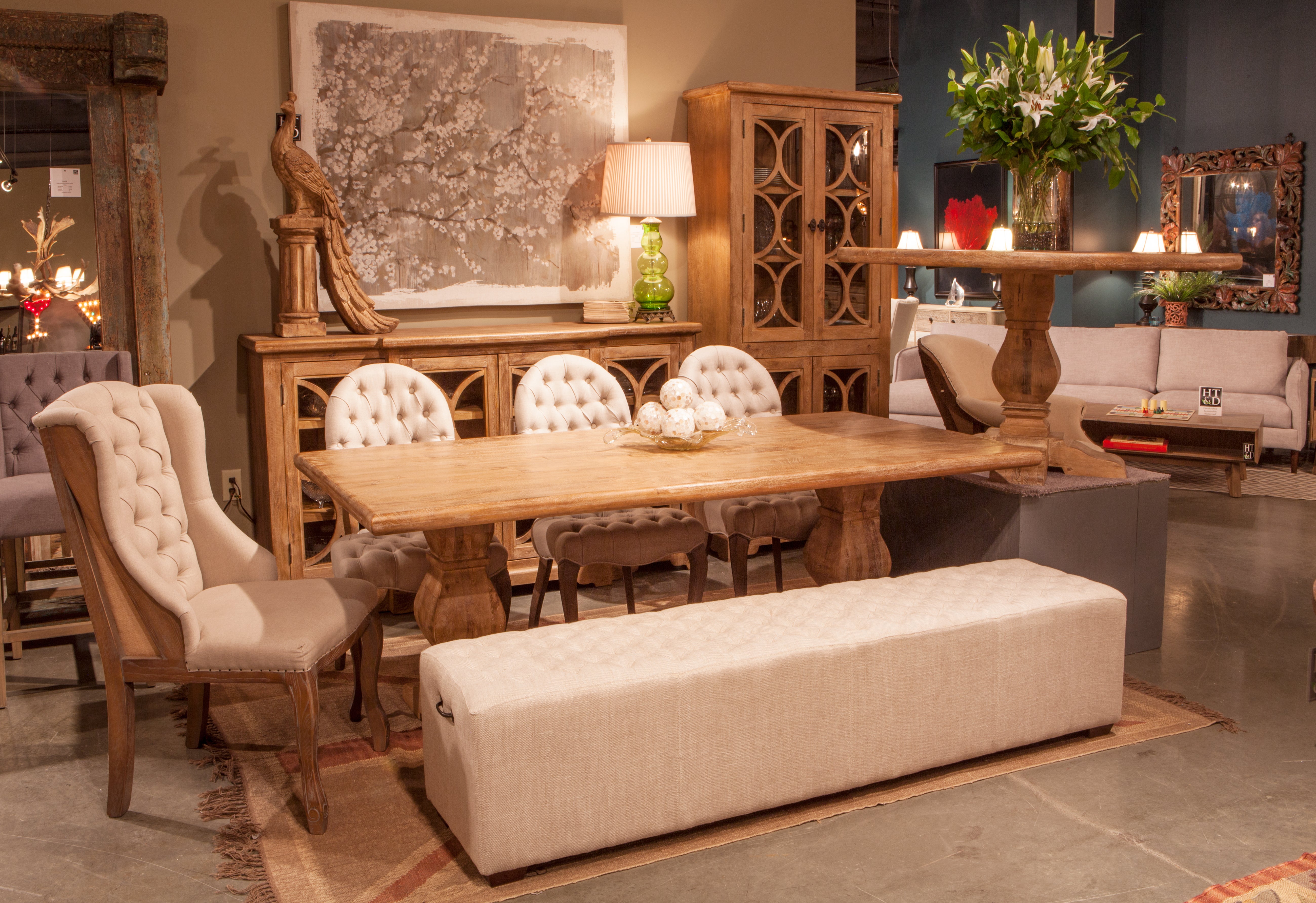 Tall Pengrove 84" cabinet crafted from solid mango wood with antique oak finish and elegant glass doors with carved detailing.