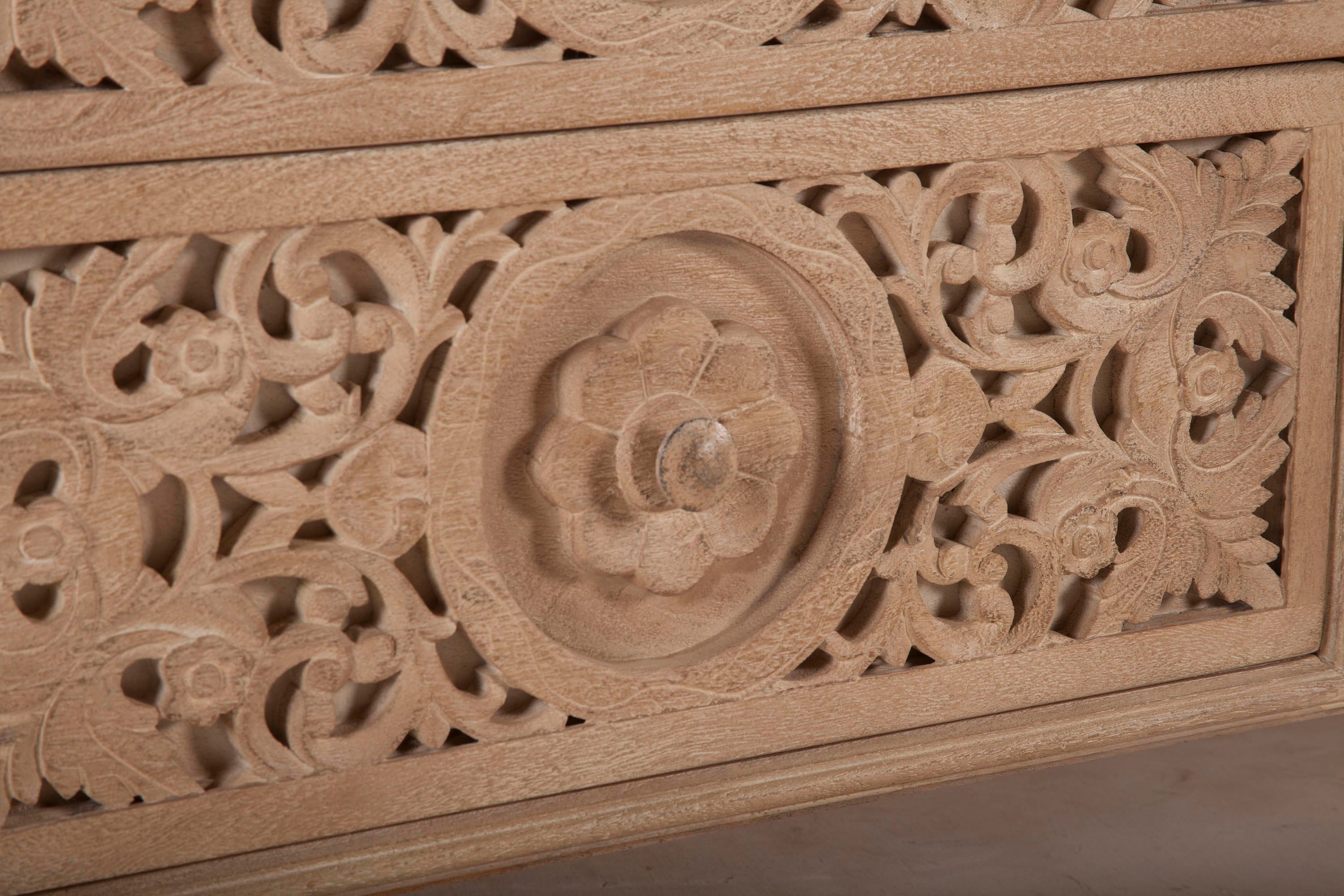 Artisan-crafted dresser with intricate carvings