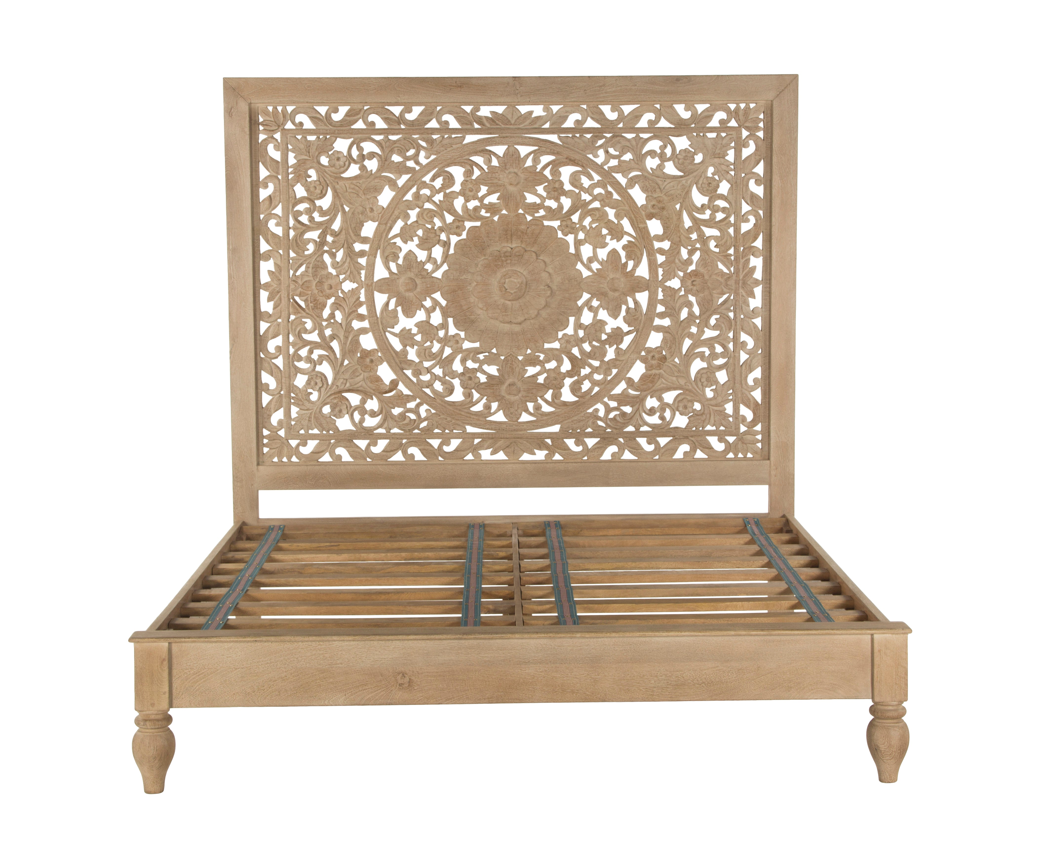 Spanish-style queen mango wood bed with turned legs and carved headboard