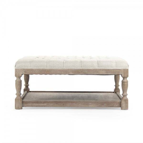 Tufted ottoman in reclaimed oak for a timeless, sustainable look.