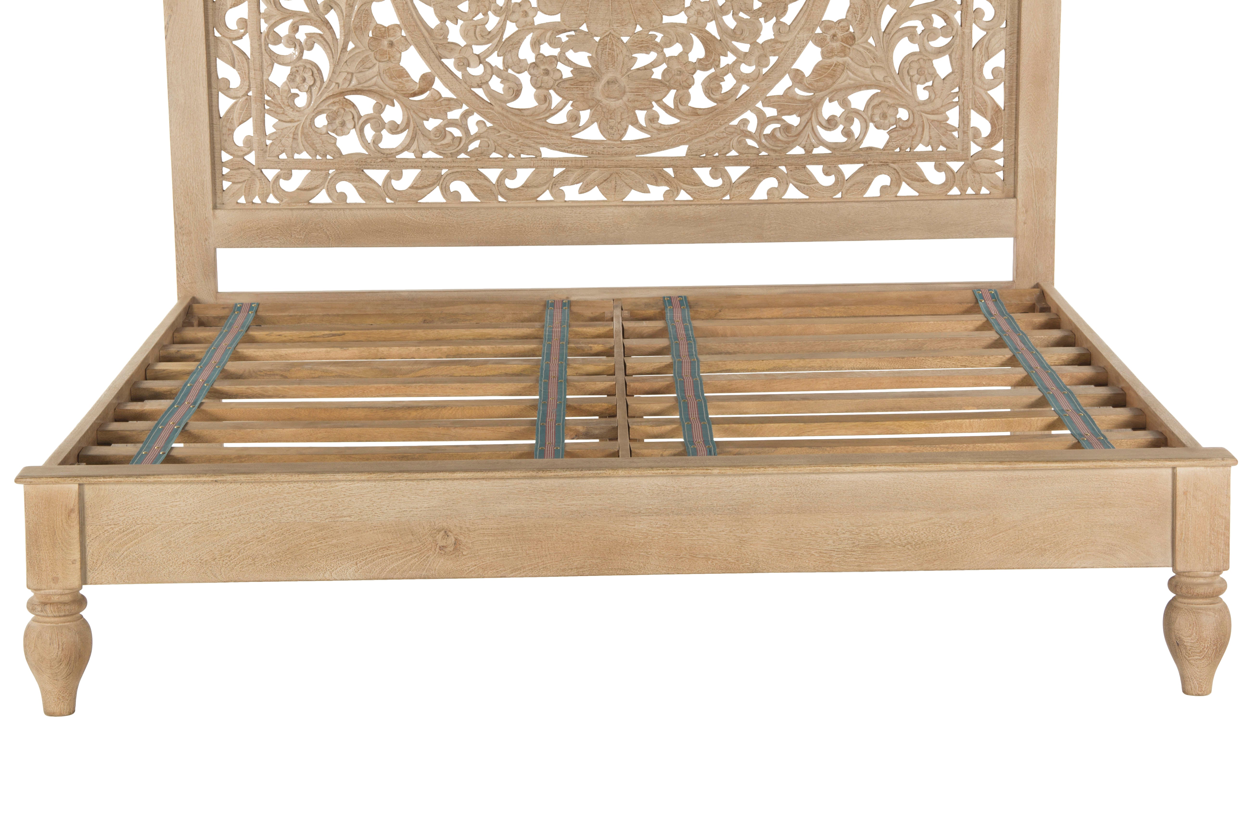 Sustainable mango wood bed in whitewash with floral headboard carvings
