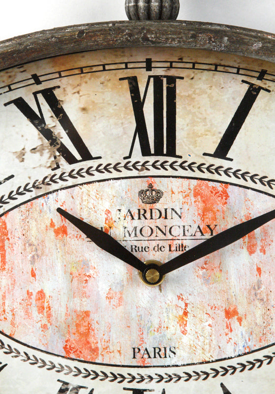 Vintage 12.5-inch oval iron wall clock with a distressed grey finish, adding rustic elegance to any room.