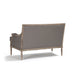 Back view of gray upholstered settee with wooden frame on a white background