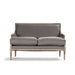 A classic French loveseat sofa with a distressed gray fabric upholstery and a weathered light brown wooden frame, shown against a plain white background.