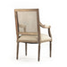 Wooden chair with cane back and beige cushion on a white background