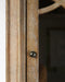 Corinne Cabinet limed grey with clear glass door and geometric wooden panel design