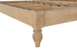 Elegant mango wood bed with hand-turned legs and decorative carvings