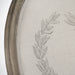 Close-up of natural linen fabric with stylist wreath design on side chair backrest